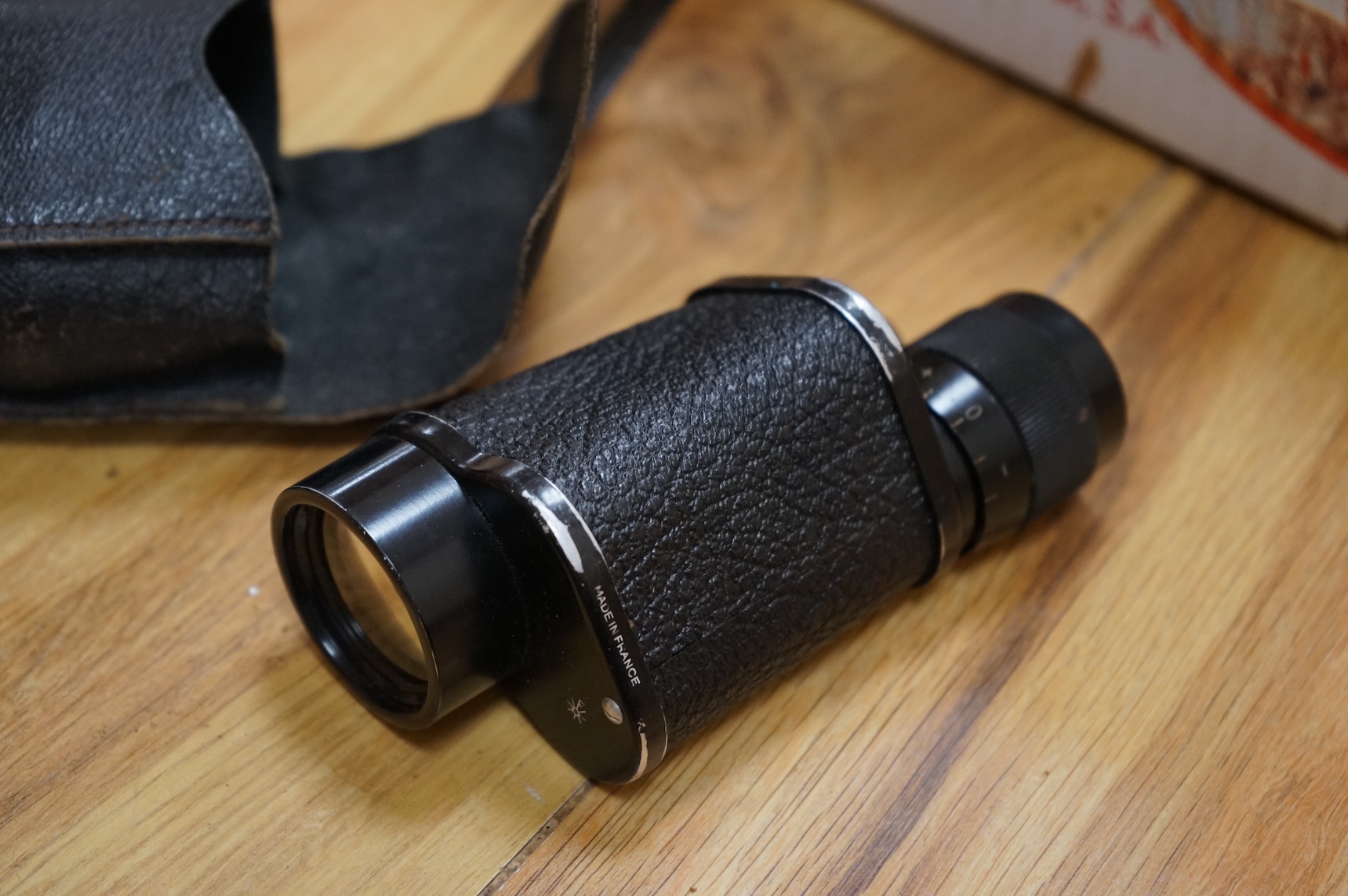 A Sykes-Fairburn Fighting Knife by Wilkinson sword in its leather scabbard, together with a 1942 Mk.III military compass by T.G.Co.Ltd. in a webbing pouch dated 1940, together with another compass, a telescope in a leath
